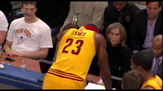 lebron james checking stats sheet against knicks
