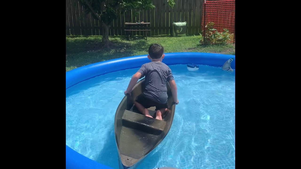 Shooting a bow in a pirogue