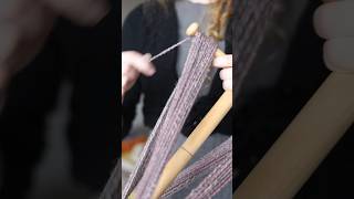 Winding a skein of yarn with a niddy noddy Resimi