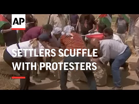 Israeli settlers scuffle with Palestinian protesters