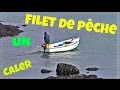 Un Pcheur Cale un Filet Entre Deux Rochers ; Bateau ; FAO27 ; Bretagne ; Rade ; France