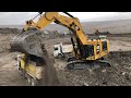 Caterpillar 6015b excavator loading trucks non stop for 3 hours  mega machines movie