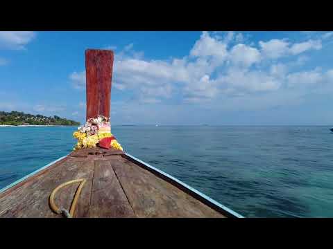 Beautiful boat trip Phi Phi Island, Tonsai pier to Viking Nature Resort, Thailand, March 2022, 4K.