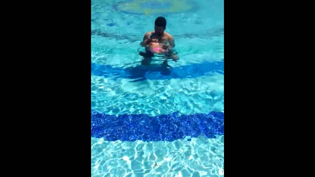 7 month old baby swimming, first swimming lesson YouTube