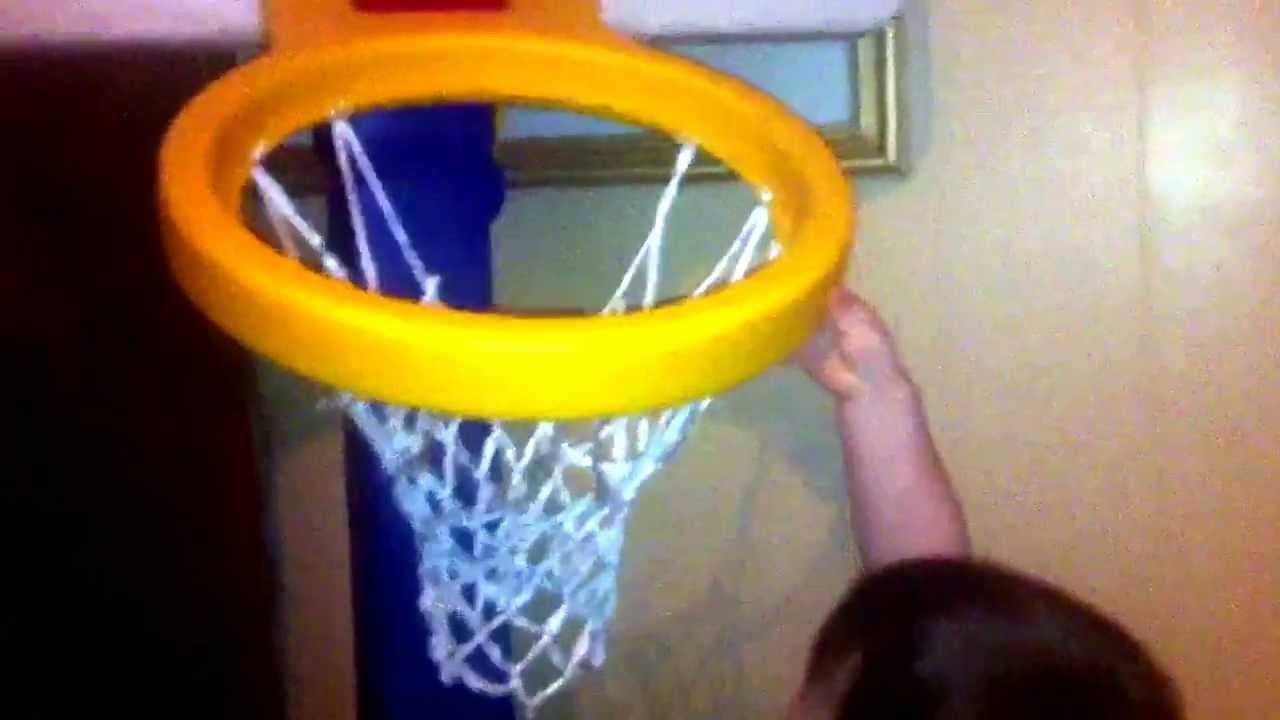 A baby playing basketball. YouTube
