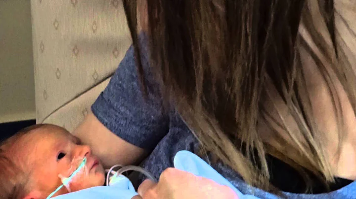 Millie Hurst a week old having a cuddle with Mummy