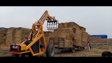G-RAFO loading the big bales at biomass power plant. 3 point  machine for loading and unloading