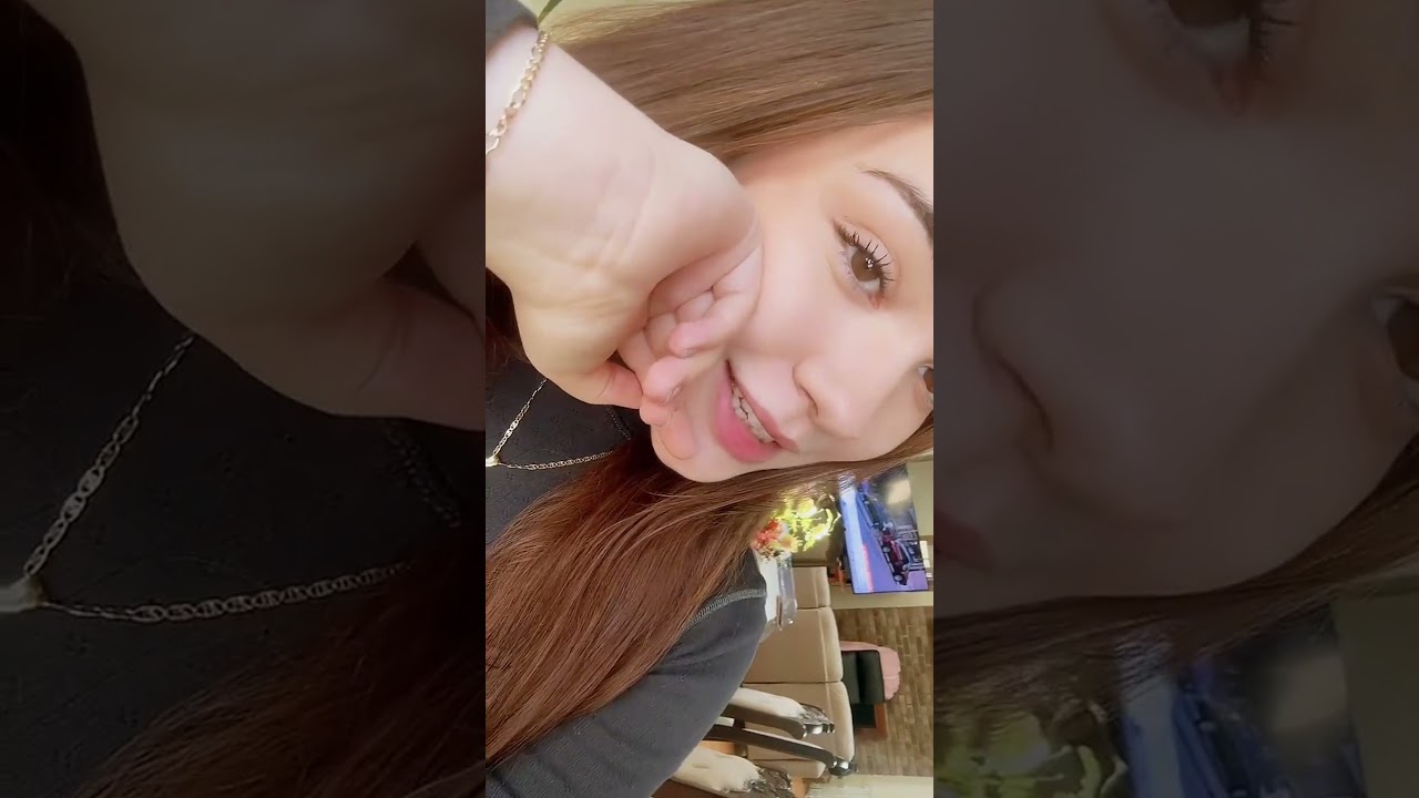 Pretty Girl Smiles and Poses to Music