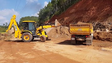 Jcb 3dx super Loading soil into a dump truck