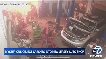 Mystery object crashes into auto shop in New Jersey, video shows