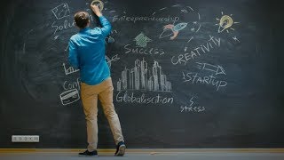 Time-Lapse/ Stop Motion of the Young Man Drawing on Blackboard Inspirational Keywords for Start-up