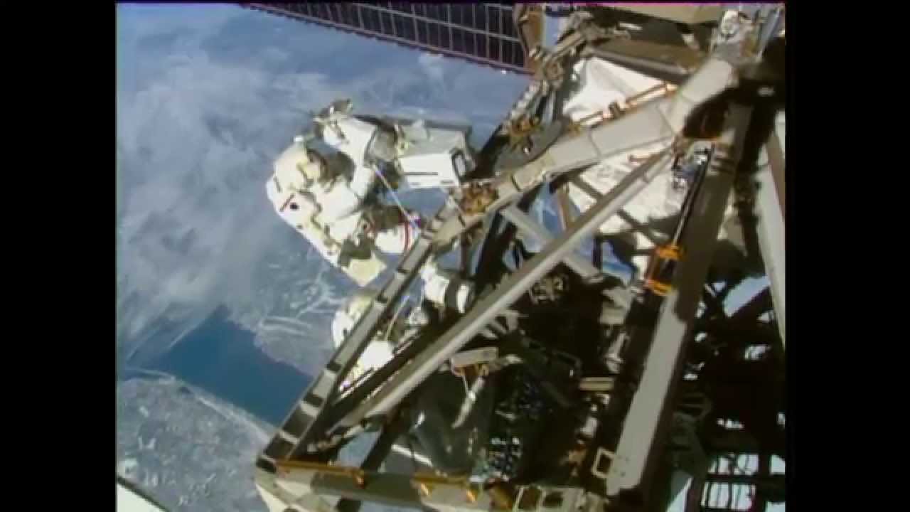 Astronauts Spacewalking Outside Space Station Install Antenna the Wrong Way