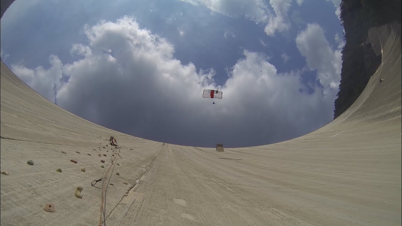 Climbing: Luzzone Dam, Switzerland. With a BASE jumper above.