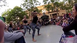 Contemporary dancers performing and interacting with the audience.