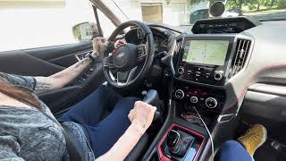 Tara demonstrates driving with the Veigel Classic II in Adaptive Mobility's Subaru. screenshot 4