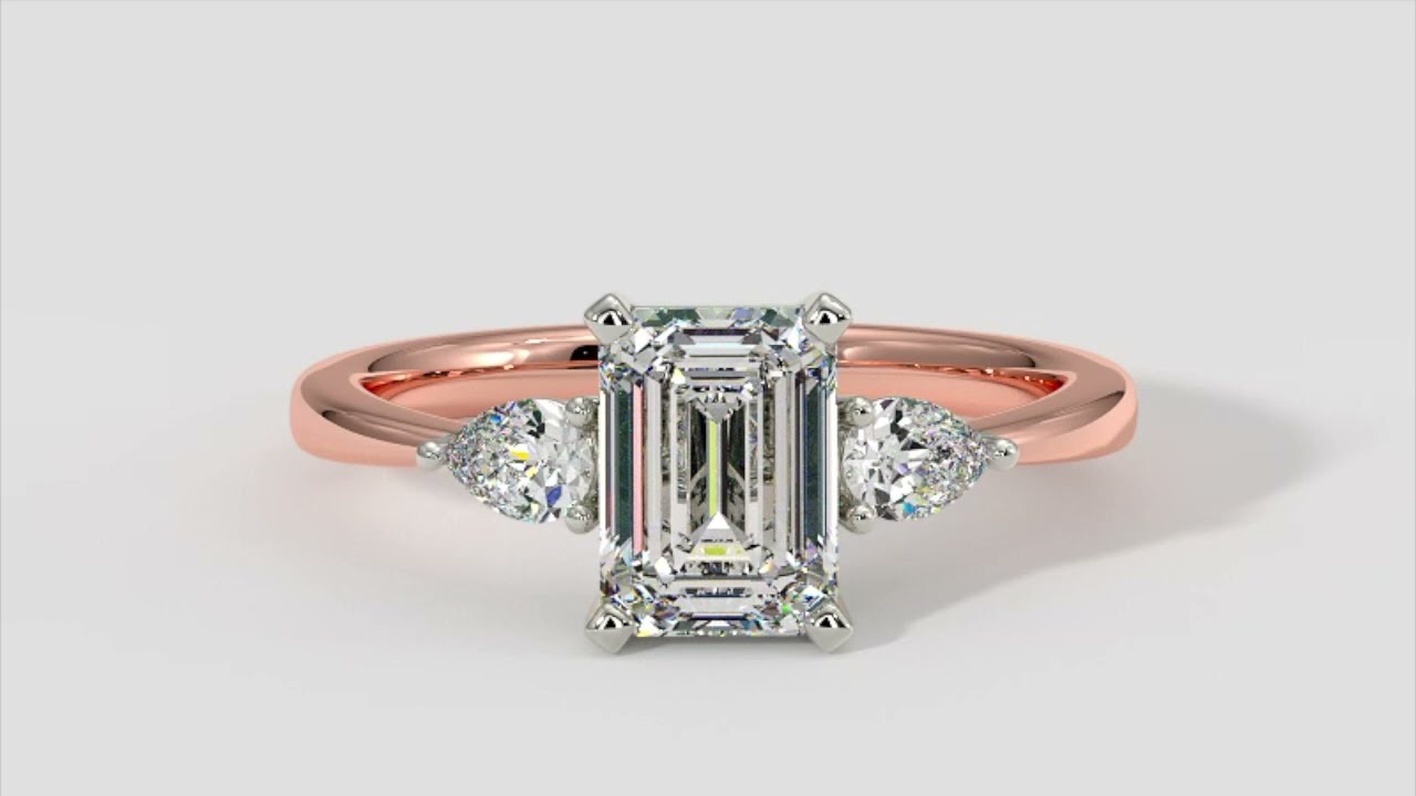 Emerald Cut Diamond Ring With Pear Shape Side Diamonds In 18k Rose and White Gold – ADN