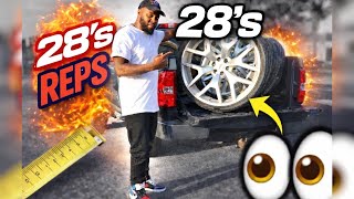 Putting 28 inch rims on a work truck in empty parking lot