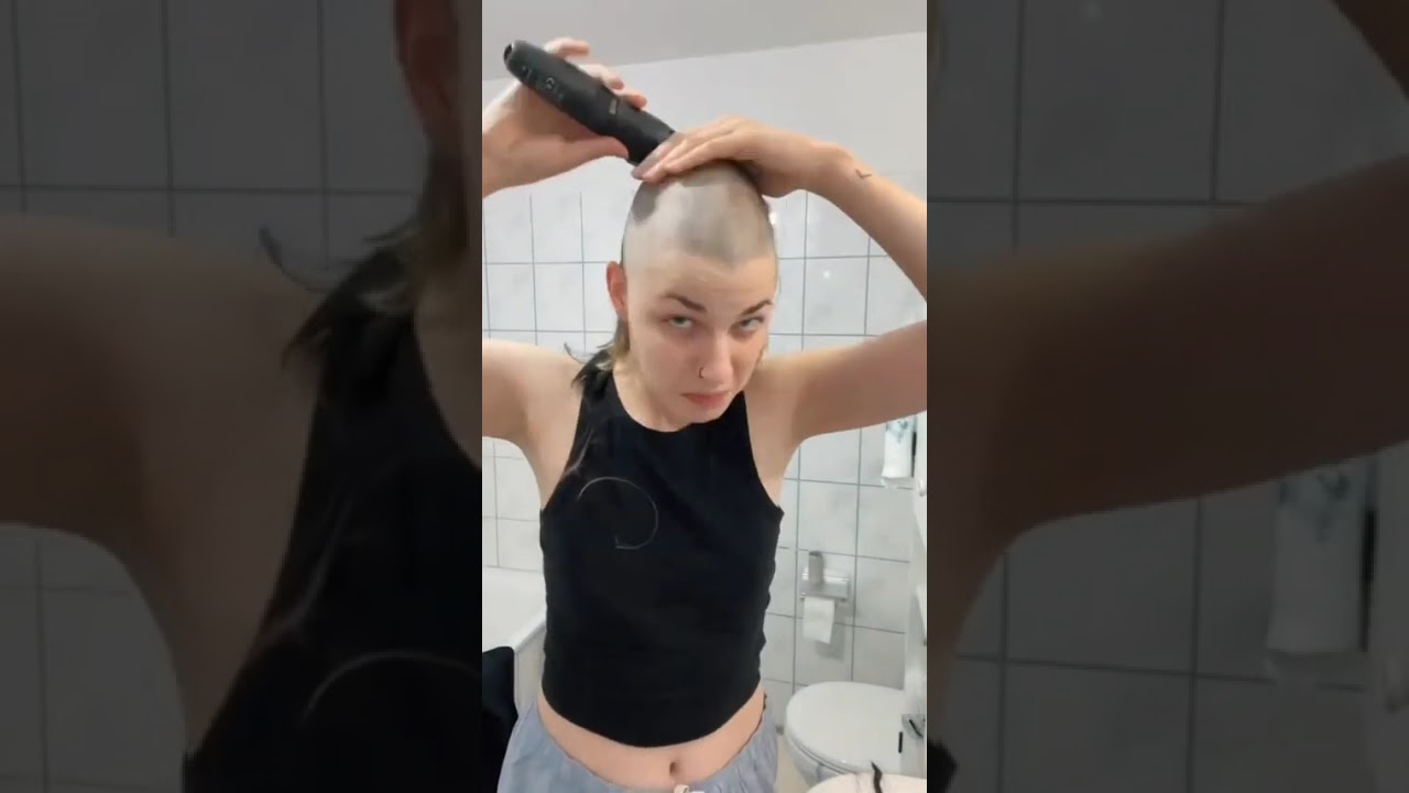 self Headshave Beautiful Lady Smiling at Mirror