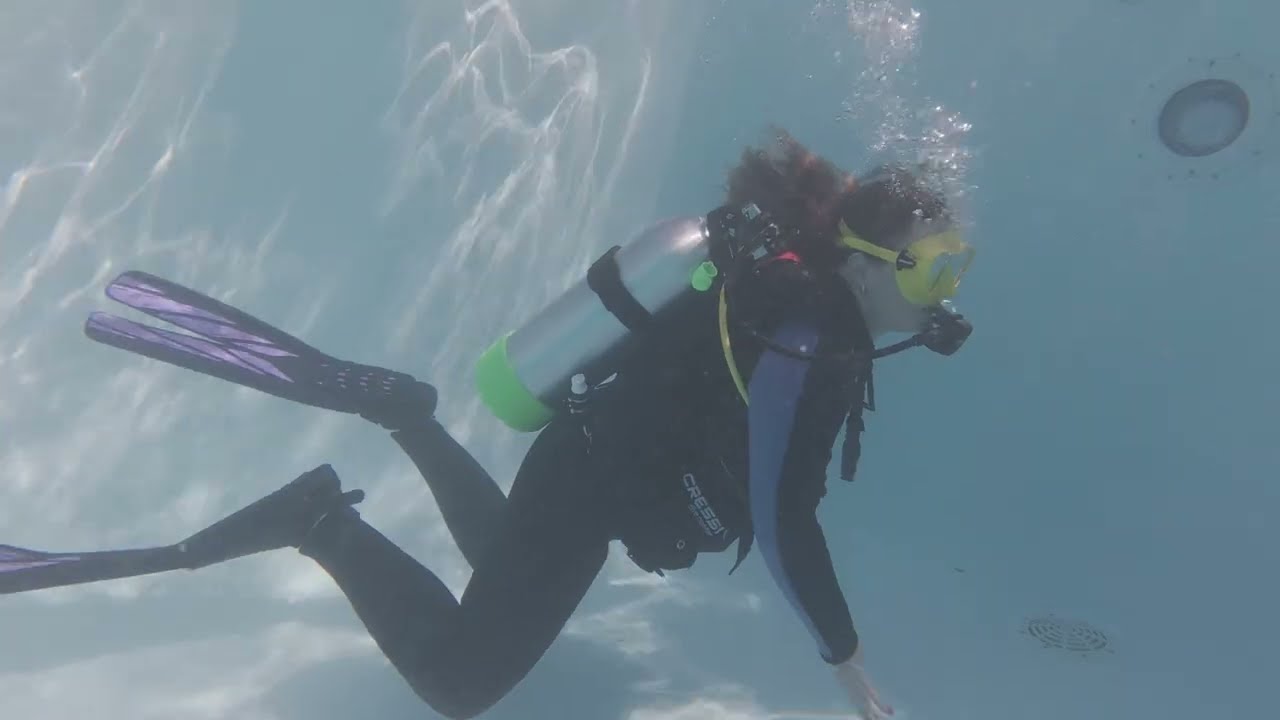 Family learning scuba