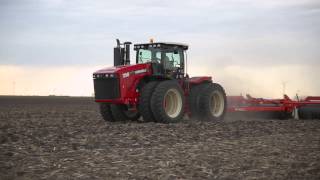 Versatile 4WD model 350 pulling a 60' Rite Way roller