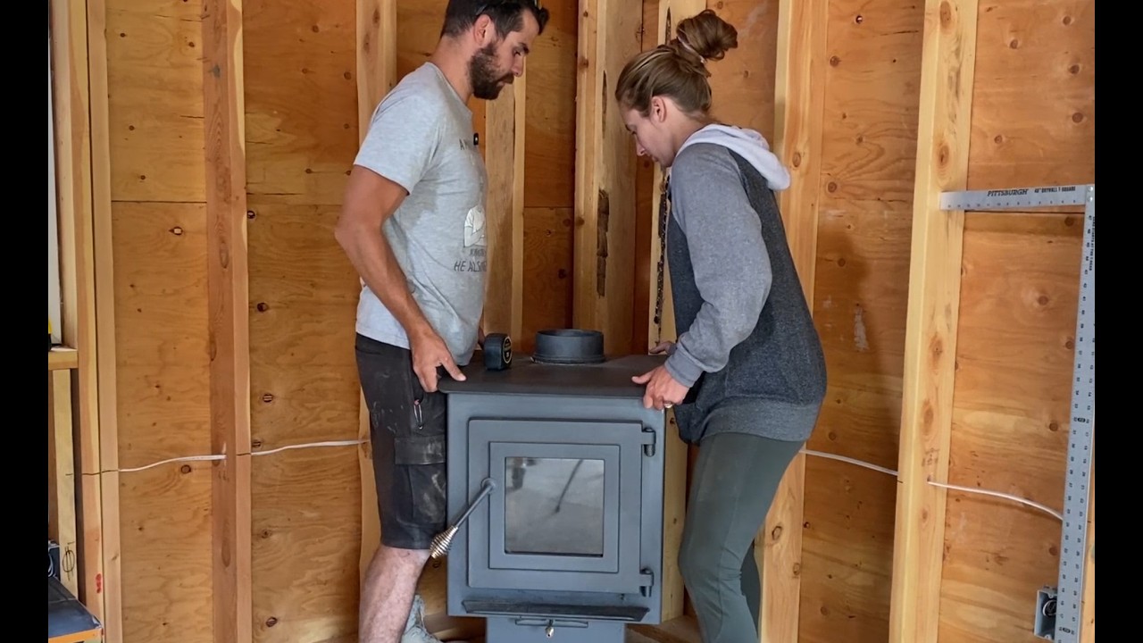 There's a HOLE in our ROOF! | Wood Stove Installation for Off Grid Cabin | Chimney Rough-In