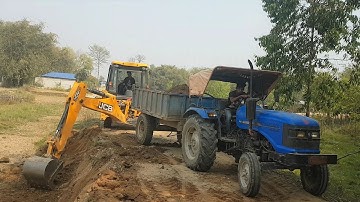 JCB Backhoe Machine Cutting Mud and Loading in Tractor - JCB Working For Village Road Construction