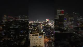 Rooftop nights in Da Nang—sparkling city lights, the beach below, and Beach Road glowing in the dist