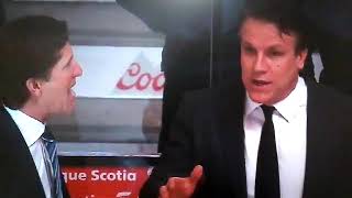 Babcock and assistant coach jim hiller have a good animated discussion
on whatever before the start of 3rd. tavares netted an overtime winner
in this game.