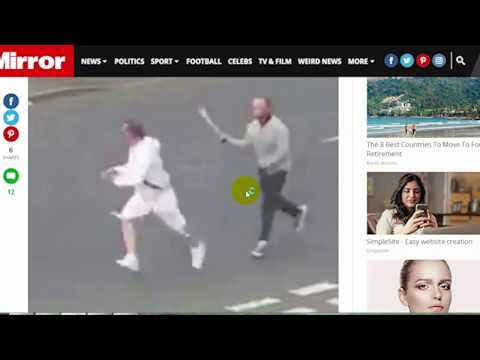 daily uk news:hug brandishing SWORD chases rival down street before fleeing when police car pulls up