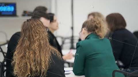 Group of professionals in a meeting discussing ideas in a confer