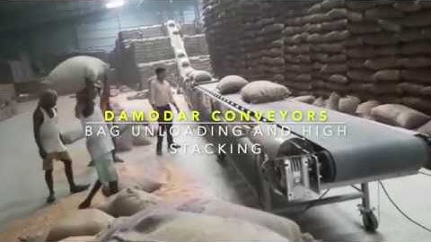 Unloading and Stacking Conveyor for Corn Bags. Mail  info@damodarprocess.com  Phone- +91 96747 45952