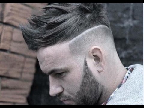 undercut hairstyle with trimmed beard