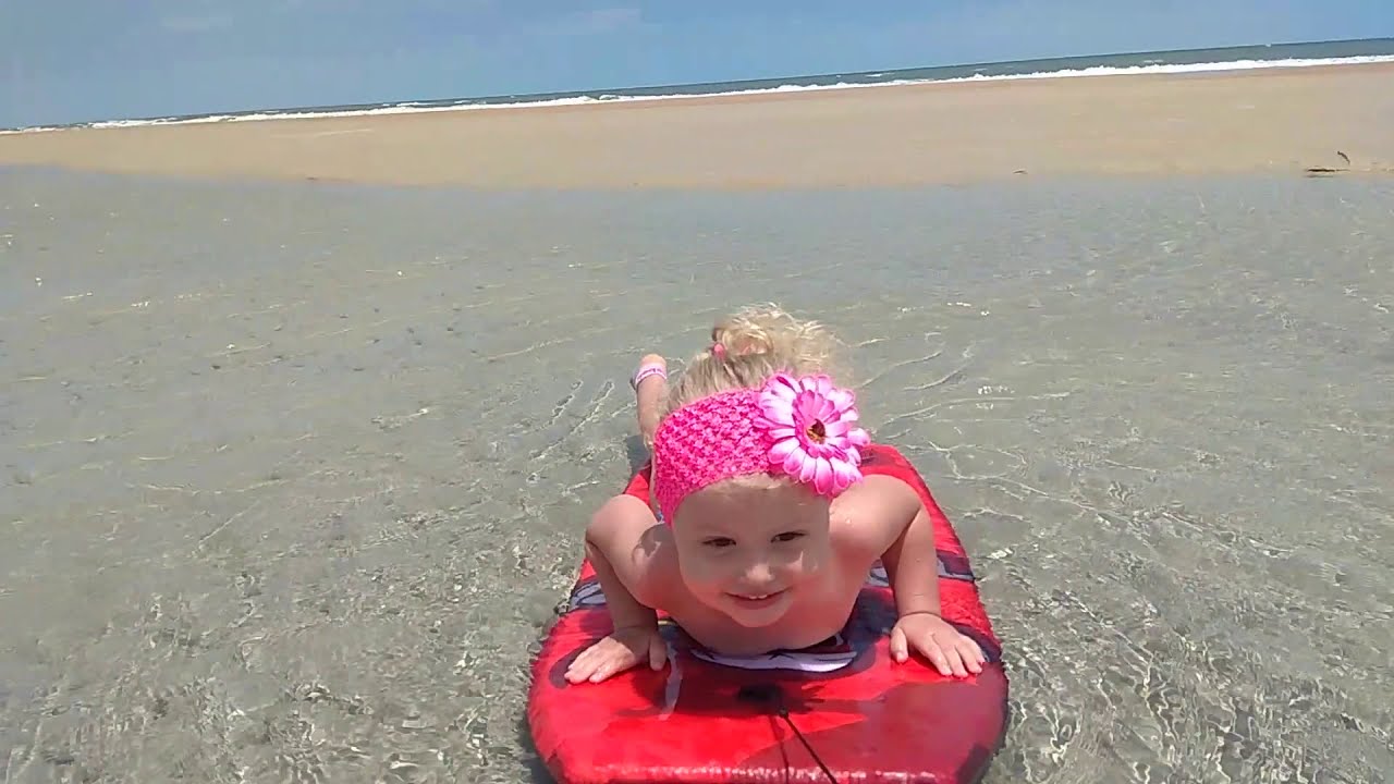 2yo baby surfing on the Atlantic ocean