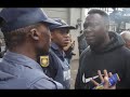 Protesters Clash with Police Outside Gupta Compound