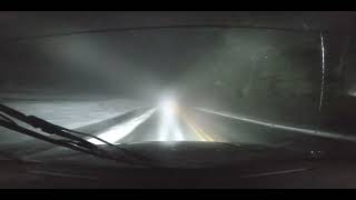 Dangerous driving in heavy fog on slick Mountain Road