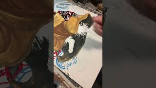 Painting aboriginal drums