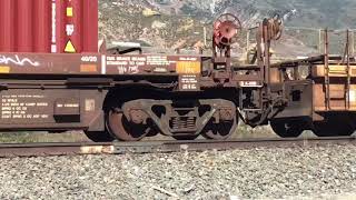 BNSF Dash 9 4611 Leads Northbound double stack train passes through blue cut CA