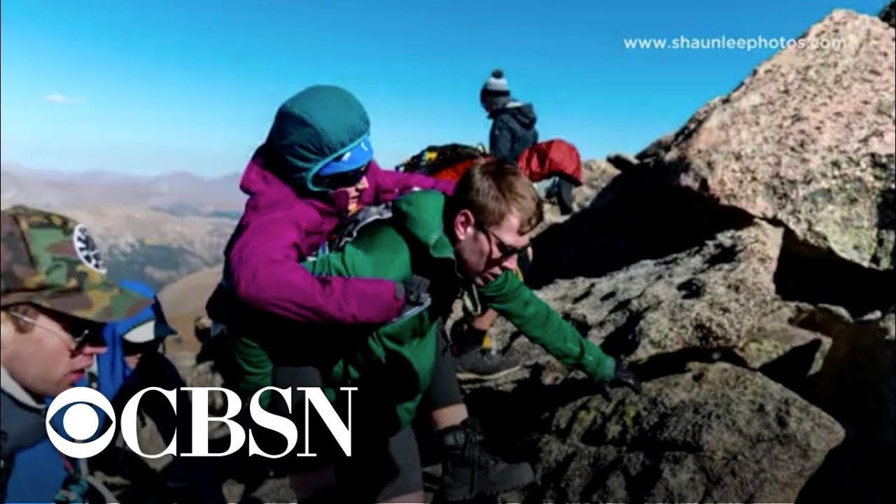 Woman in wheelchair climbs 14,000 foot mountain