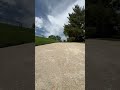 Rollerblading off a rock wall onto the sidewalk at Tanks Skate Park in Highlands Ranch Colorado