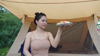 Beautiful girl solo camping overnight in the rain relaxing in the tent,sound of nature,cooking ASMR