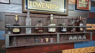 Rustic Liquor Shelf from Pallet Wood, Iron Pipe, and Metal Bracketry