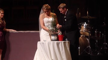Instead of a unity candle this couple plants a tree together