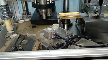 TAPA CAP LINER FOIL CUTTING PUNCHING LINING WADDING INSERITNG MACHINE.