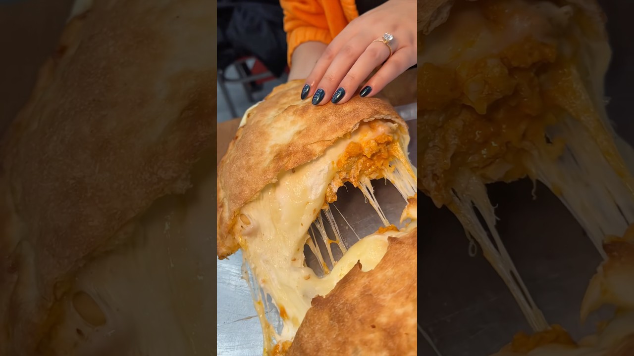 SUPER CHEESY BUFFALO CHICKEN CALZONE at  Nuovo York Pizza in NYC’s East Village!🧀🍕🔥 #DEVOURPOWER