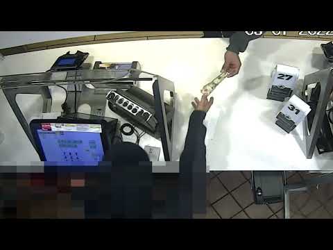 <p>Surveillance footage of the armed robbery</p>