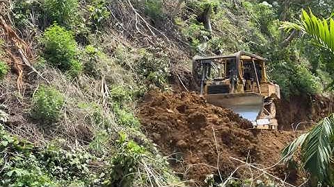 The Skill of the CAT D6R XL Bulldozer Operator in Cutting Through Hills for Road Construction