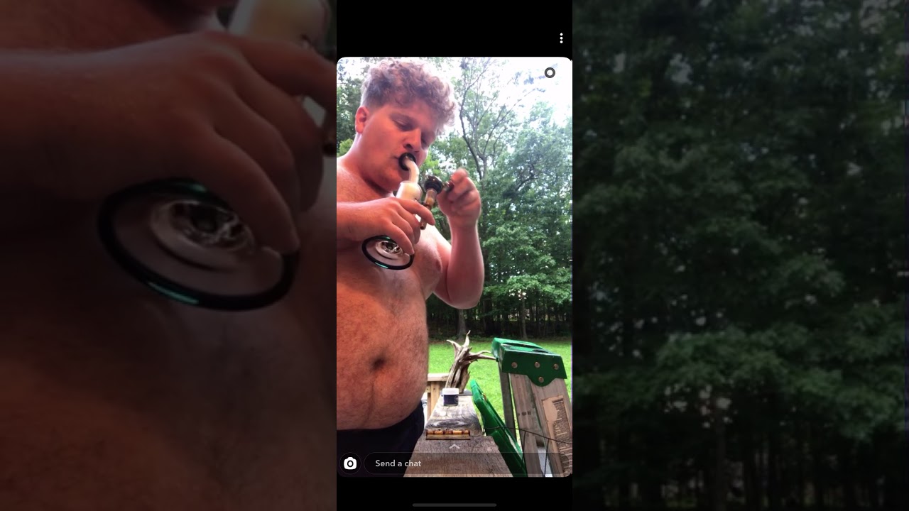 Fat boy takes bong rip like a G