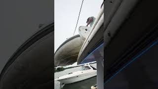 Hoisting up the dingy to the top deck