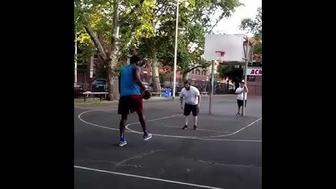 Joel Embiid casually dunking on a trash talker at the park