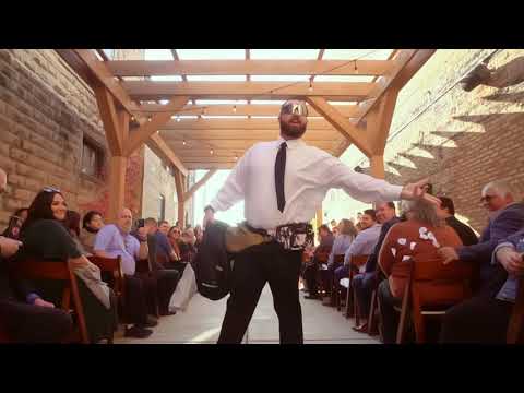 Flower man showers wedding guests with petals & tequila